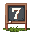 A small chalkboard easel with a single number on it